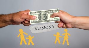 https://www.hobokenlawblog.com/files/2019/10/Two-hands-holding-dollar-bill.-People-fighting-over-money-300x164.jpg