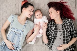 Two-young-women-a-lesbian-homosexual-couple-ADOPTION-300x200